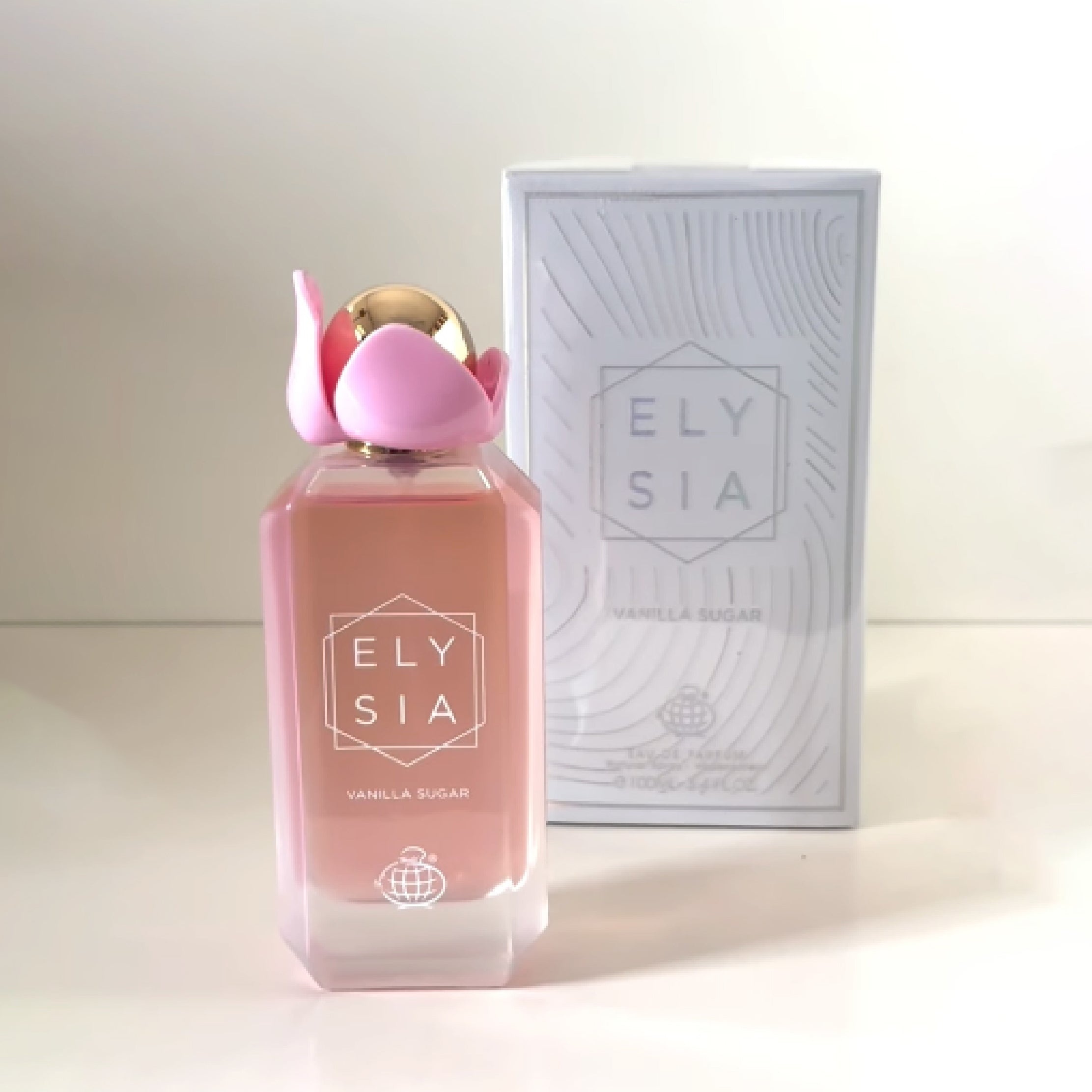 Pink Ely sia perfume bottle with matching box on a white background