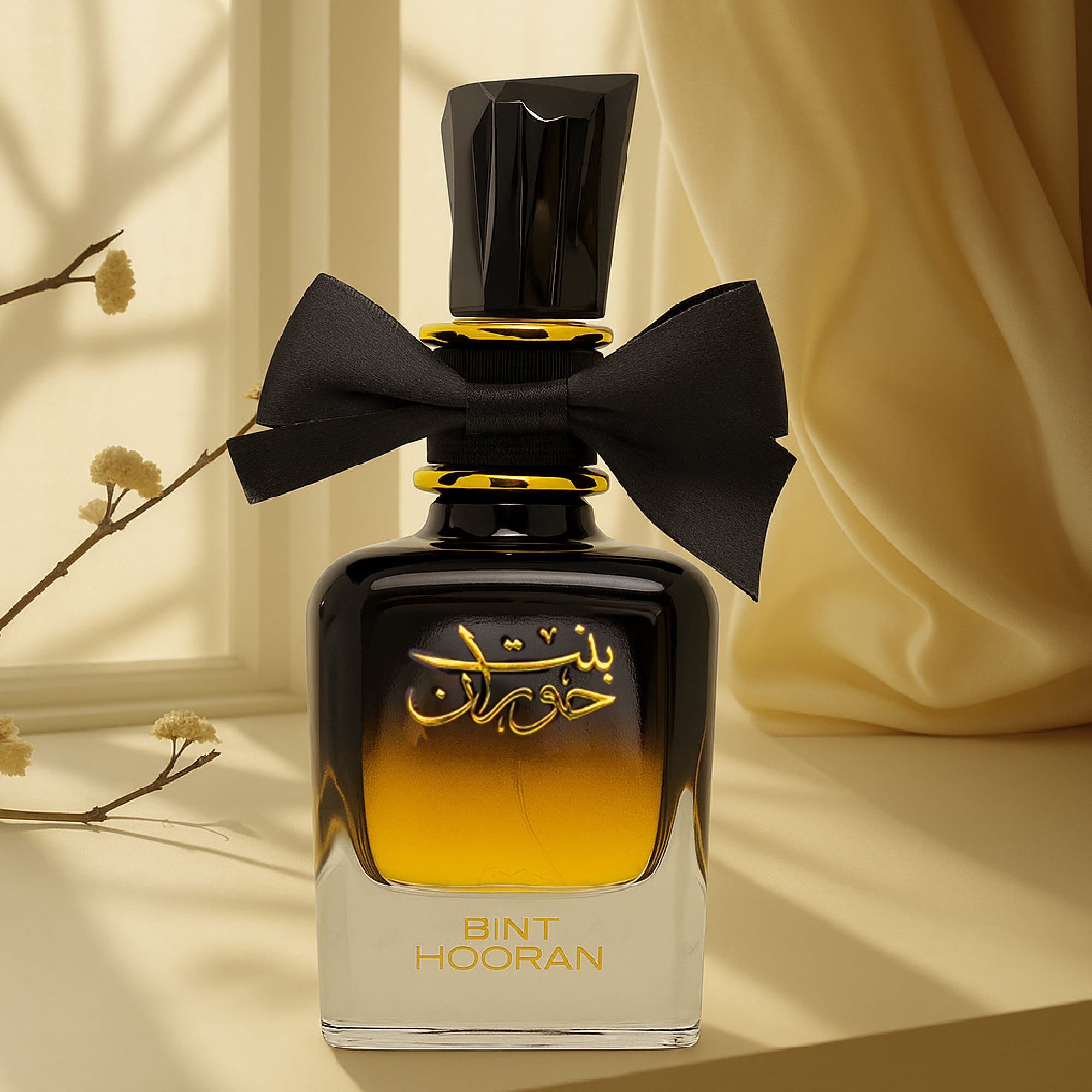 Perfume bottle with black and yellow design on a neutral background