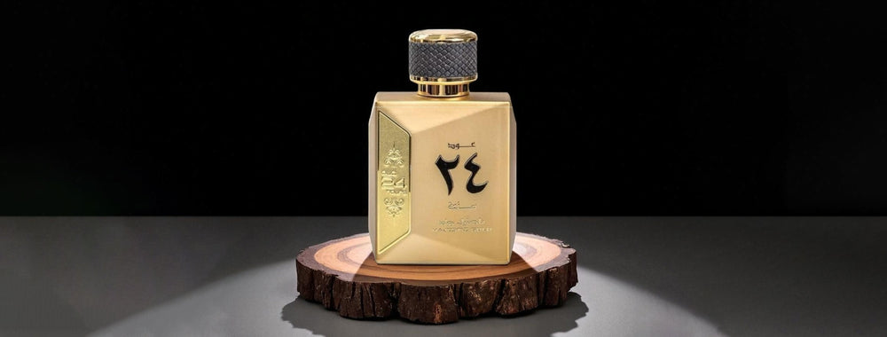 Gold perfume bottle with black text on a dark background