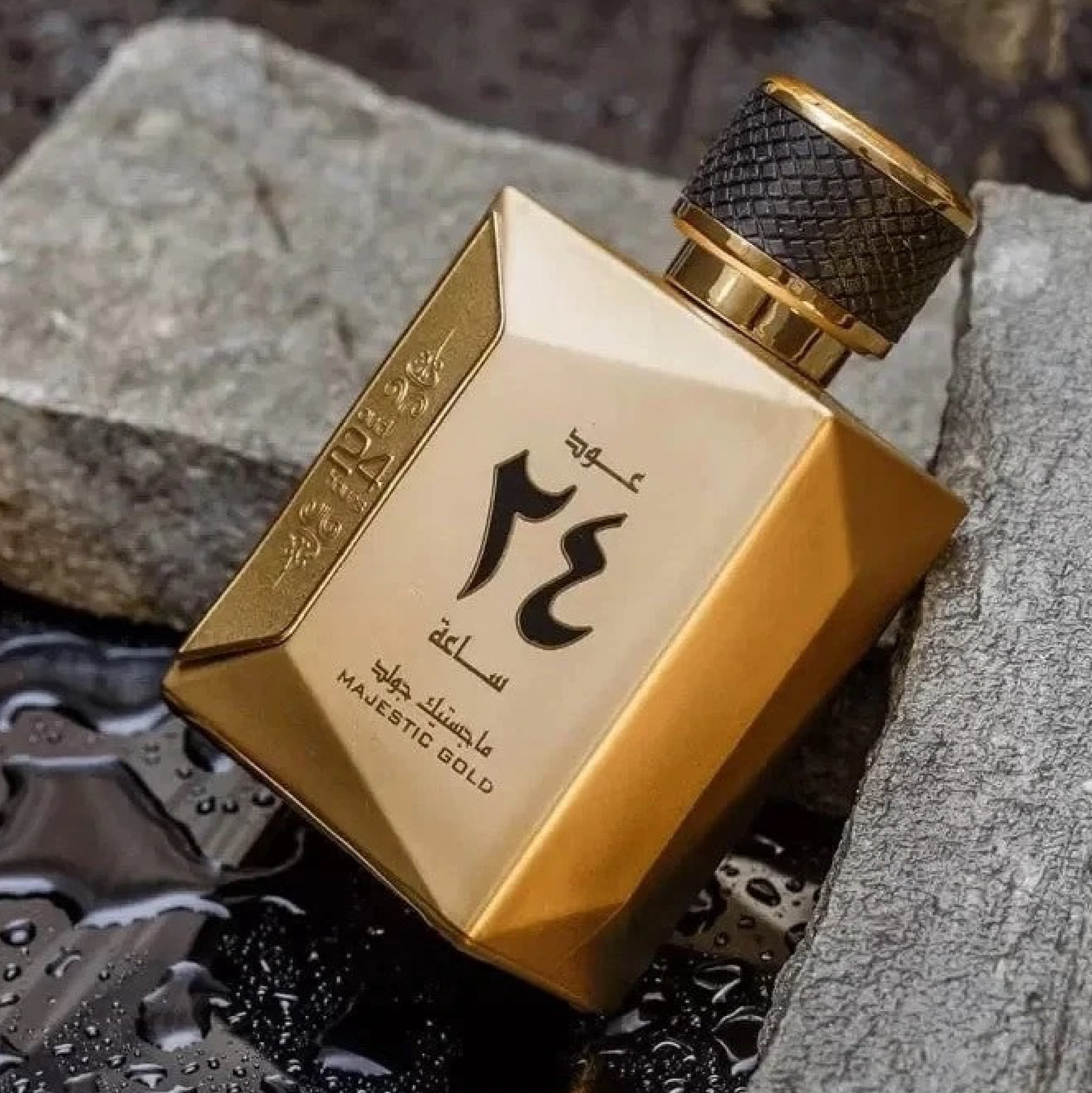 Gold perfume bottle with intricate design on a textured surface