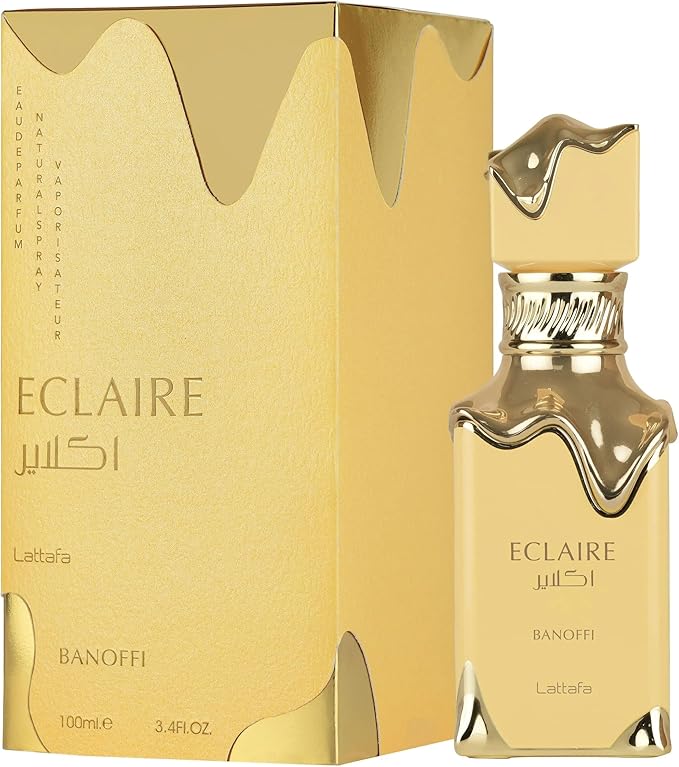 Gold Eclaire perfume bottle and packaging on a white background