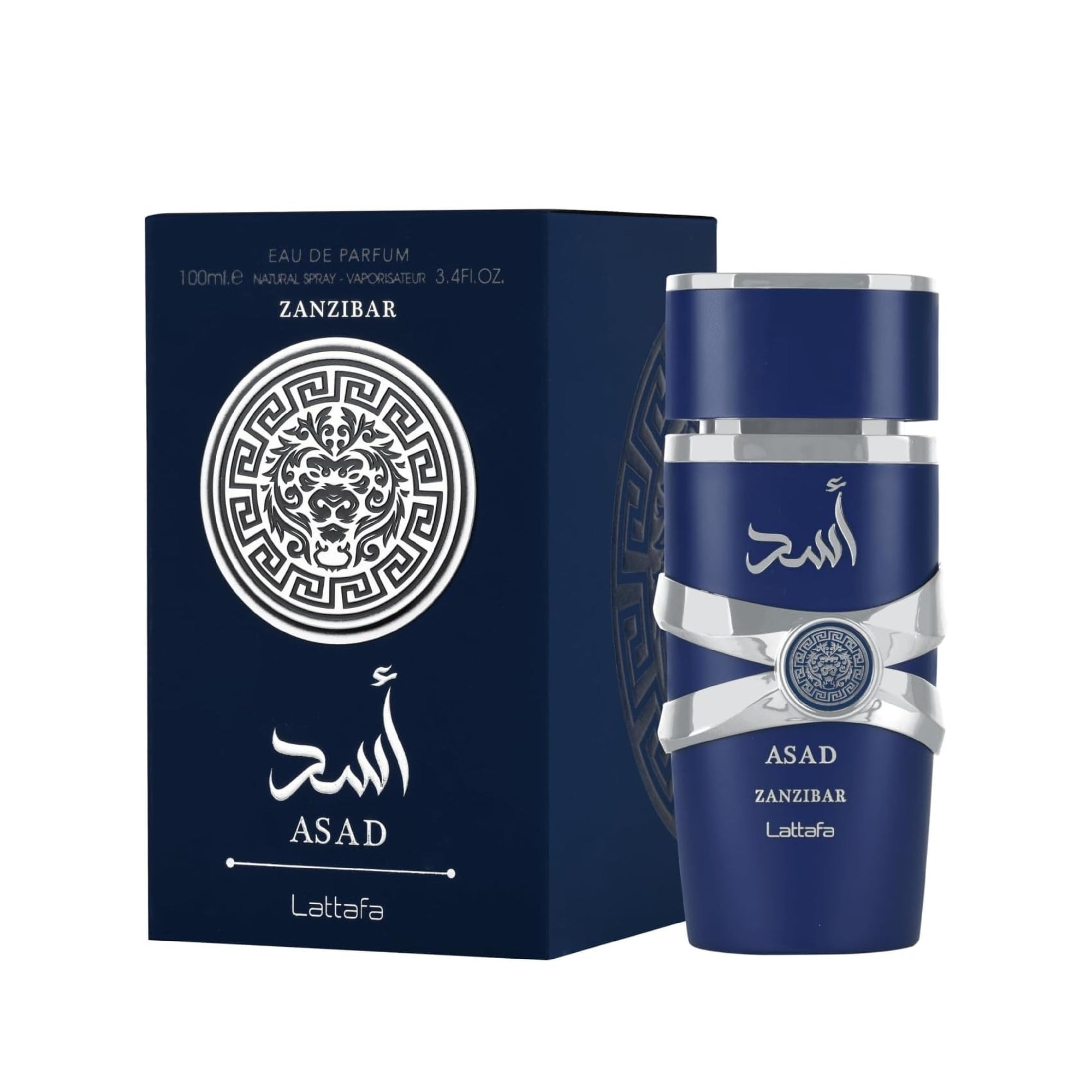 Blue bottle with white text on a wooden surface with beige towels and a lamp in the background