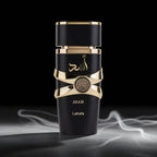 Black and gold perfume bottle with 'Lattafa' branding on a dark background