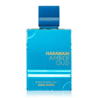 Blue perfume bottle with 'Haramain Amber Oud' text on a white background
