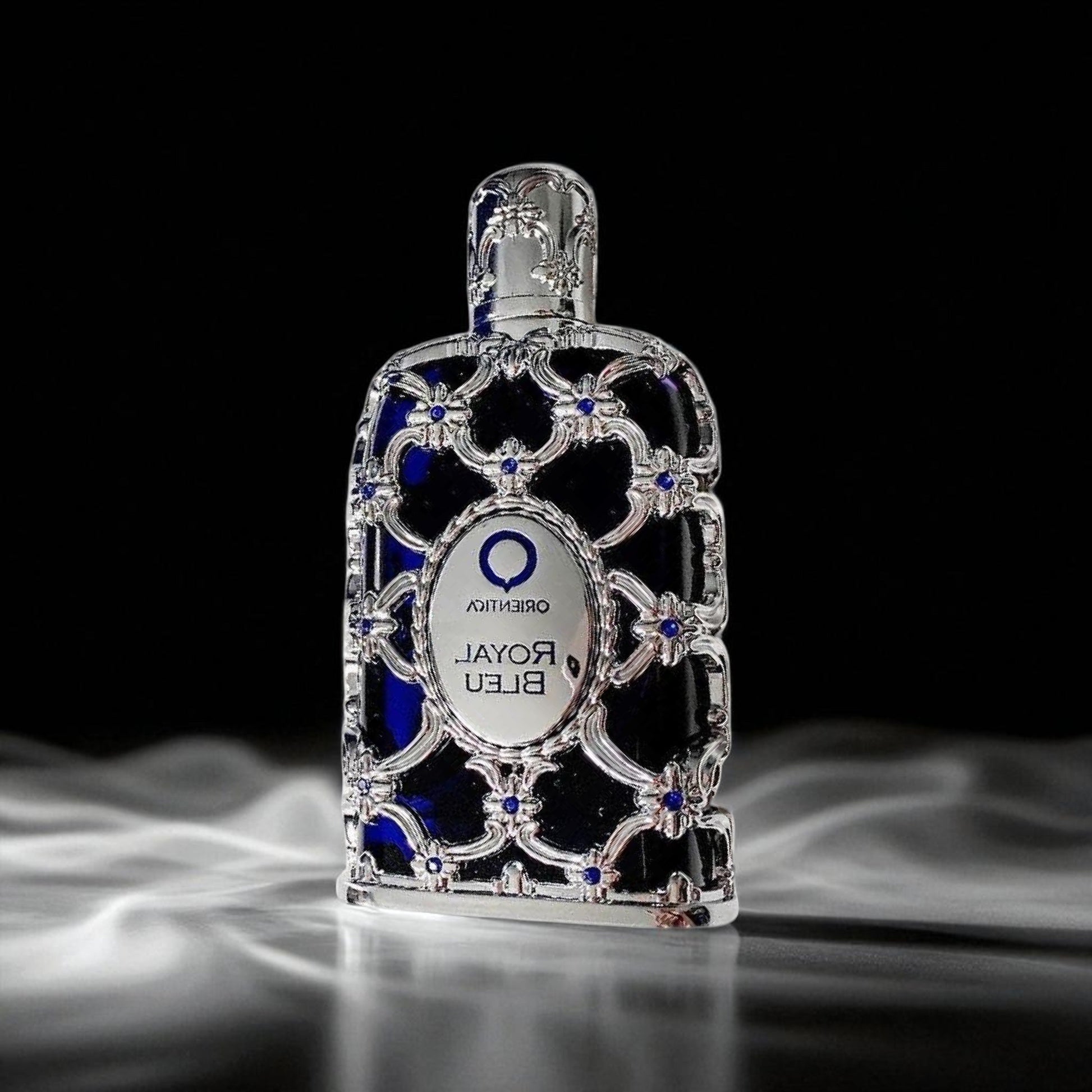 Decorative bottle labeled 'Oriental Royal Bleu' on a black background