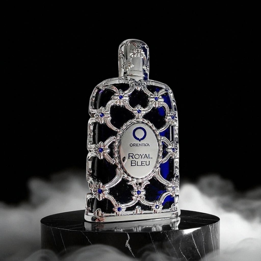 Decorative bottle with 'Orienta Royal Bleu' label on a black background