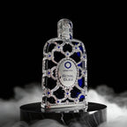 Decorative bottle with 'Orienta Royal Bleu' label on a black background