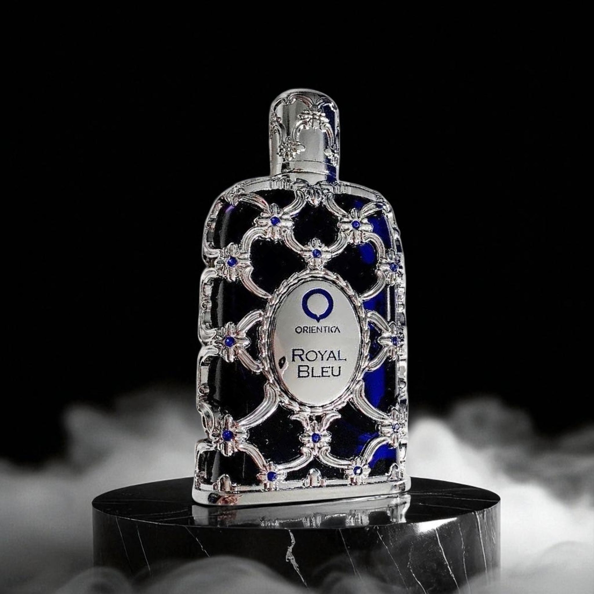 Decorative bottle with 'Orienta Royal Bleu' label on a black background