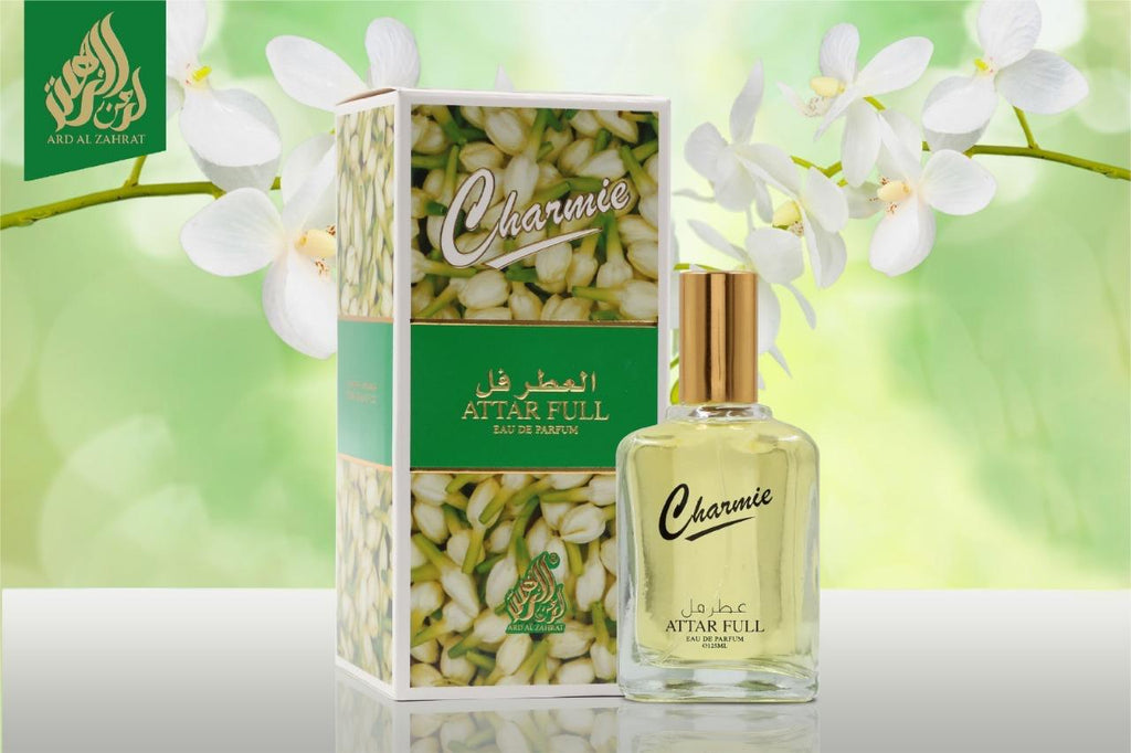 Perfume bottle and packaging with 'Charmie' branding on a light green background with flowers.