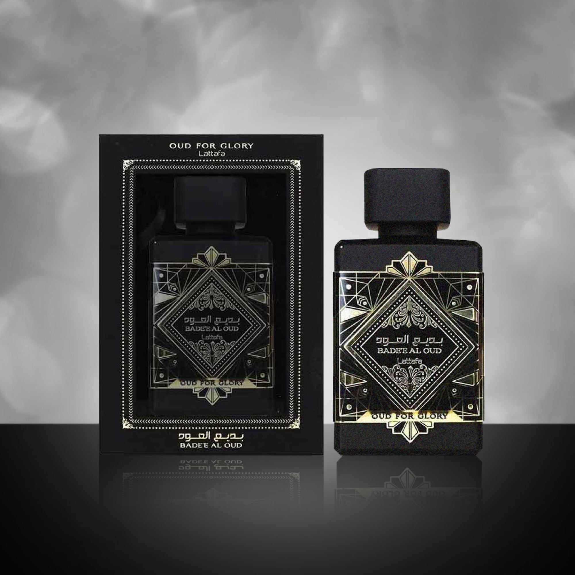Black perfume bottle with gold detailing and packaging on a gray background