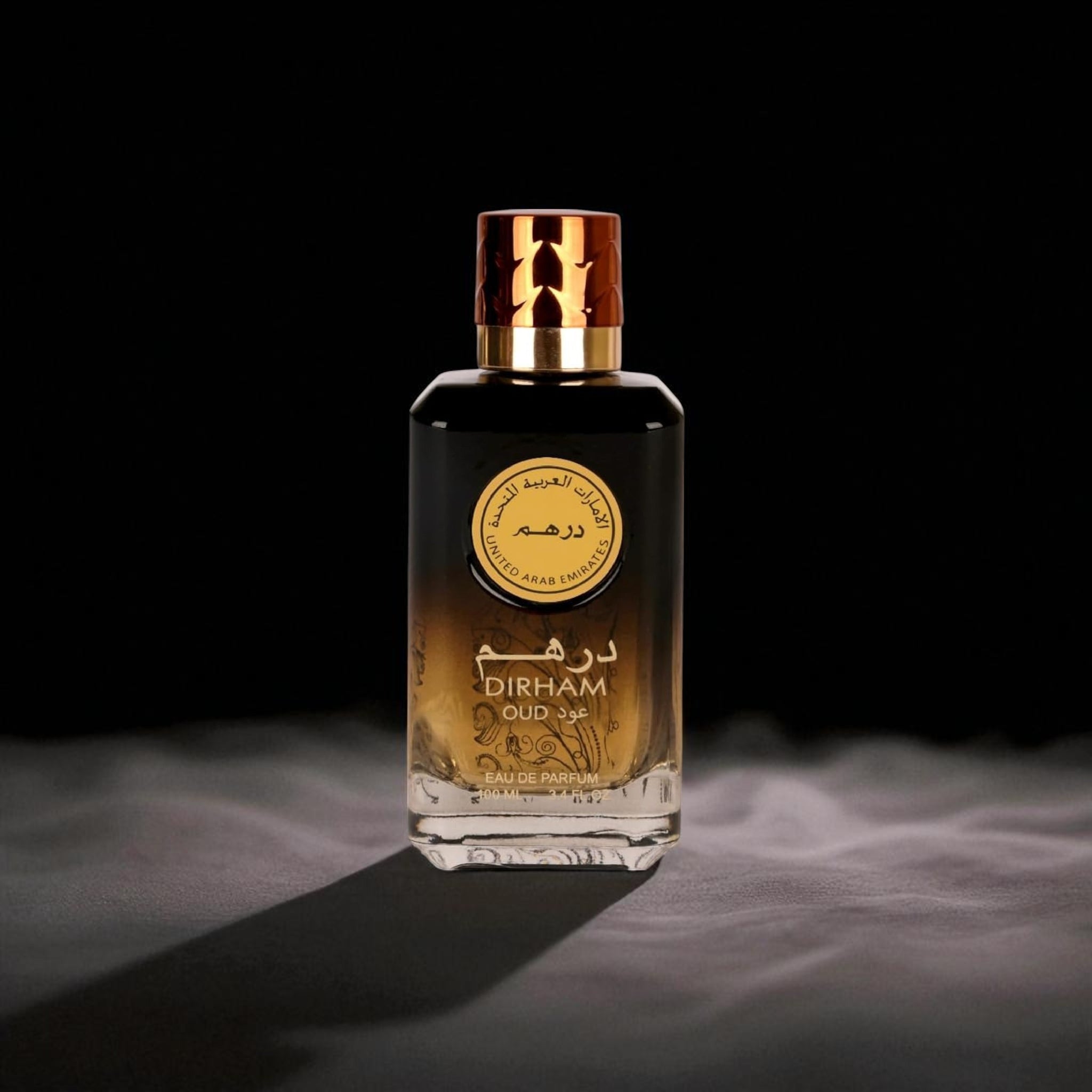 Perfume bottle labeled 'Dirham Oud' on a dark background