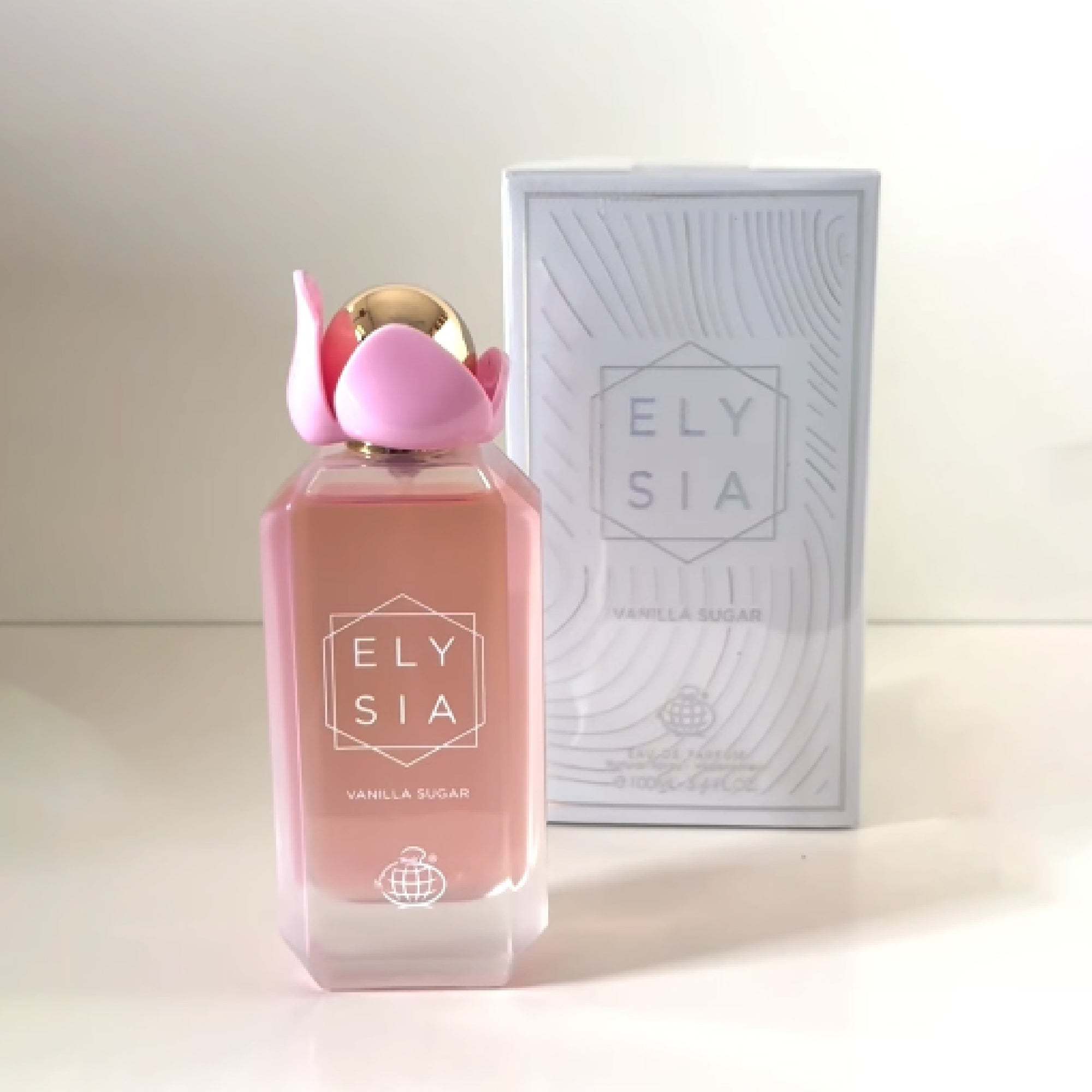 Pink Ely sia perfume bottle with matching box on a white background