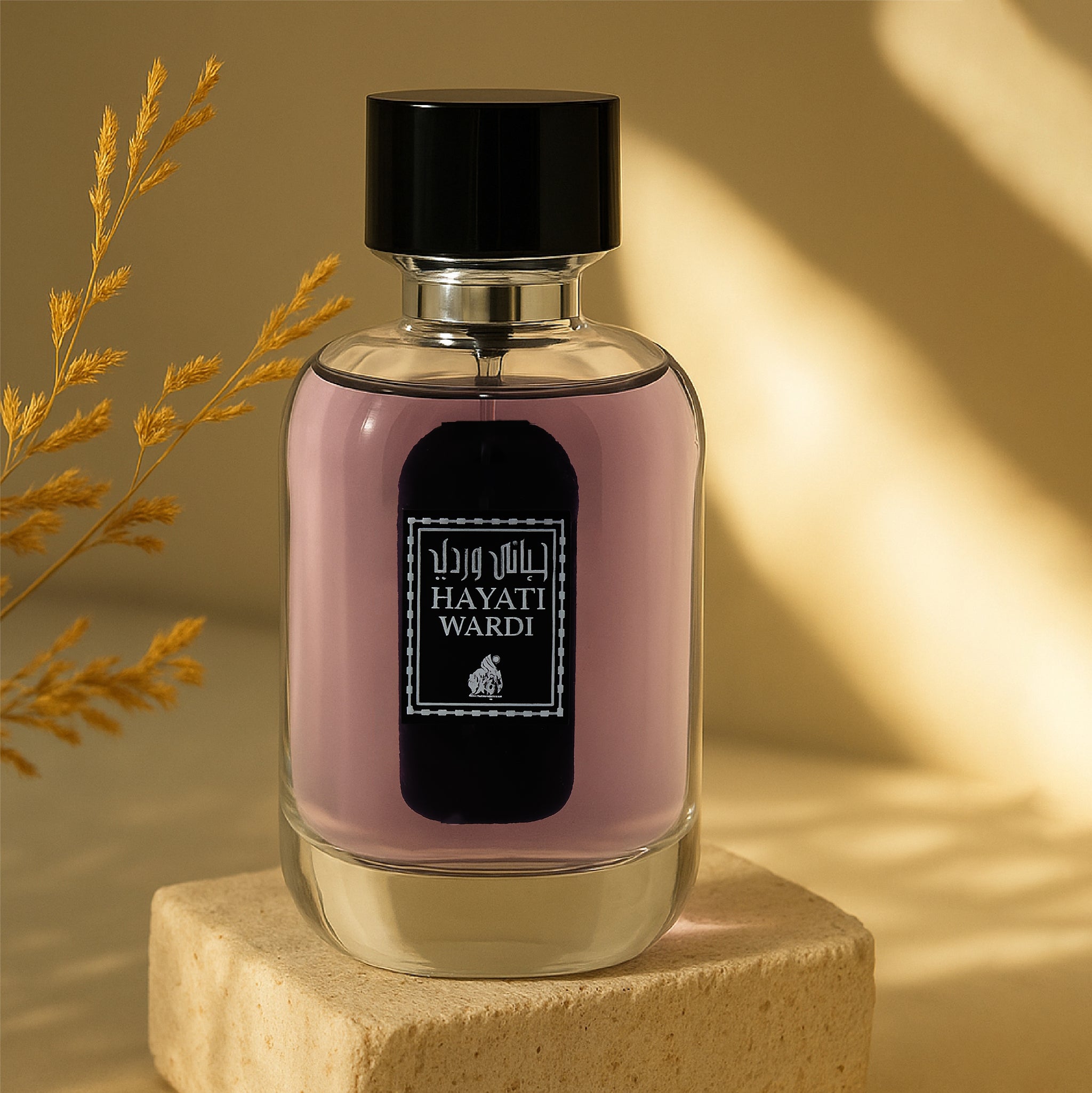 Perfume bottle with 'Hayati Wardi' branding on a beige background