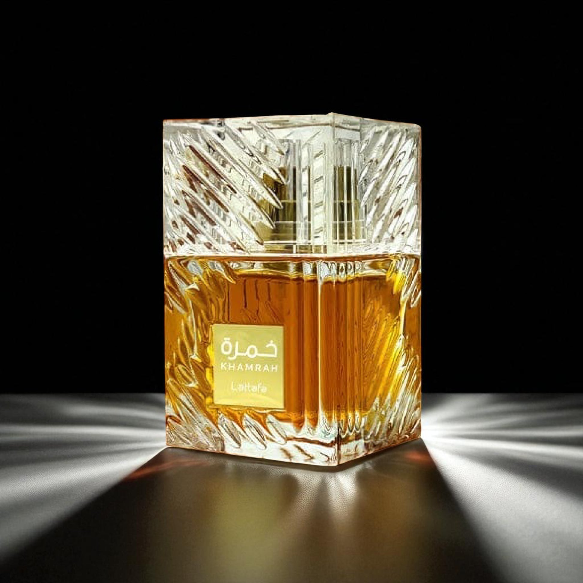 Perfume bottle with a gold label on a black background