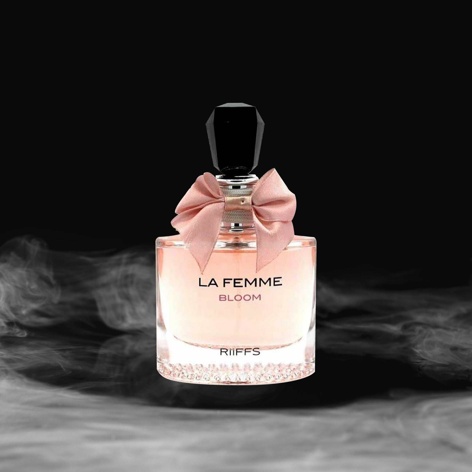 Perfume bottle labeled 'La Femme Bloom' by Riiffs with a pink bow on a dark background