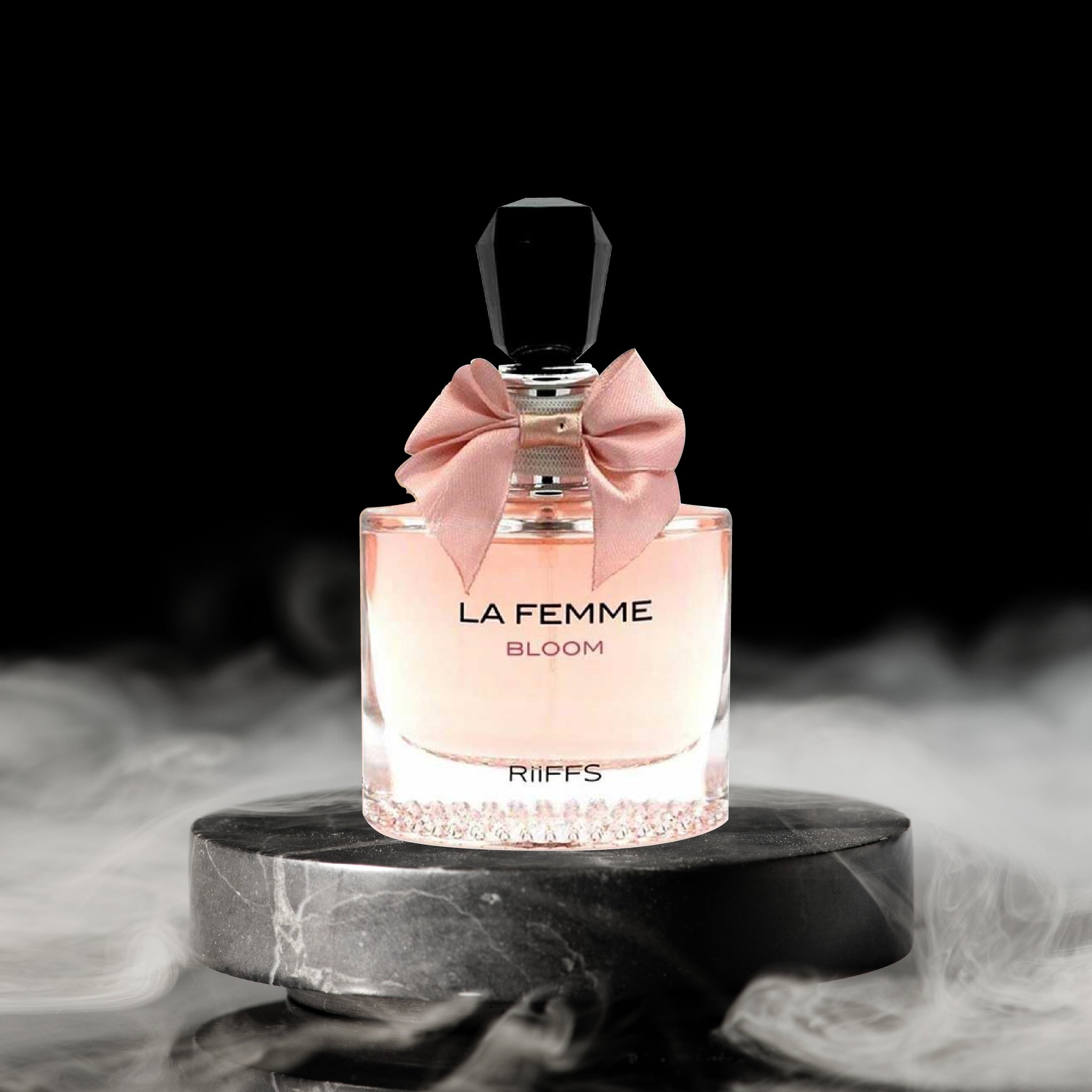 Perfume bottle labeled 'La Femme Bloom' by Riiffs on a dark background