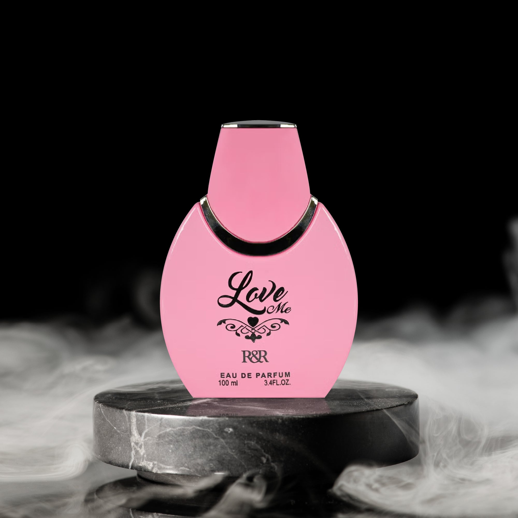 Pink perfume bottle labeled 'Love Me' on a dark background