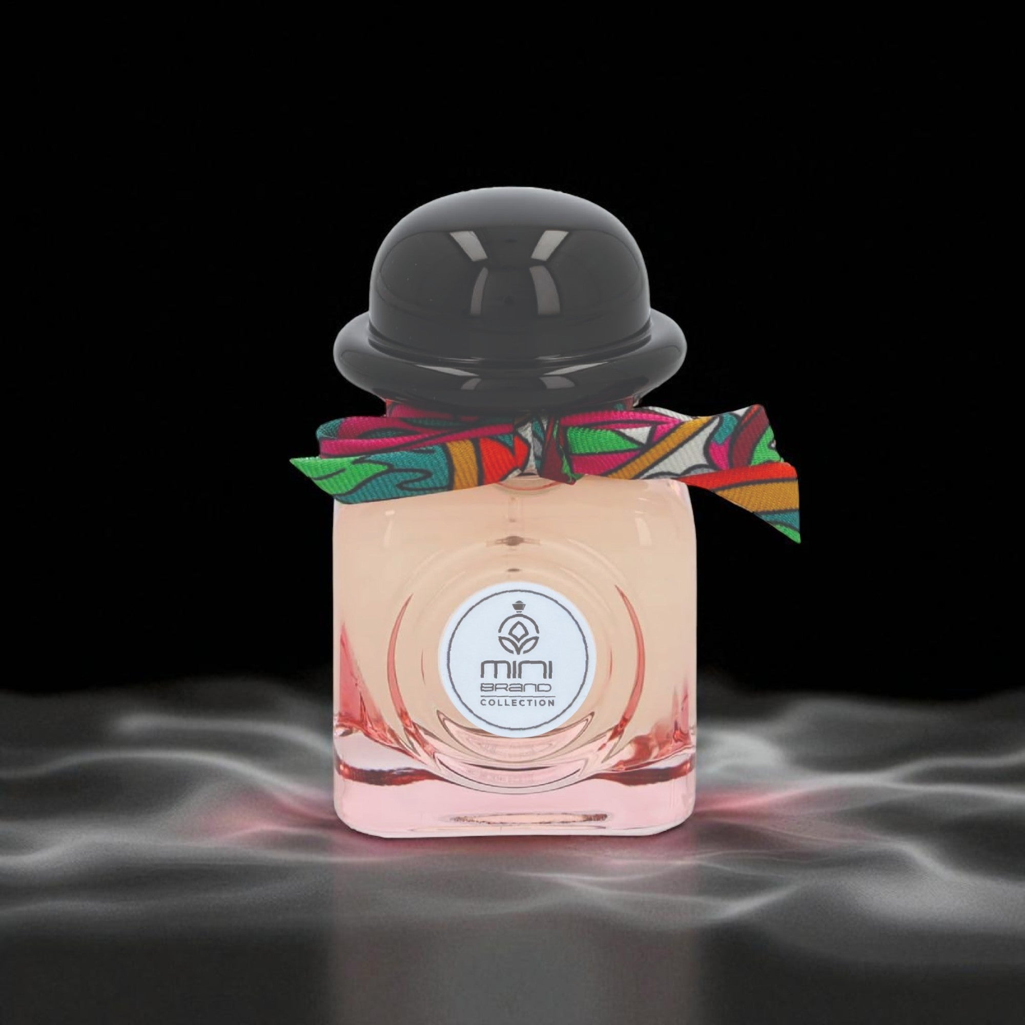 Perfume bottle with colorful ribbon on a dark background
