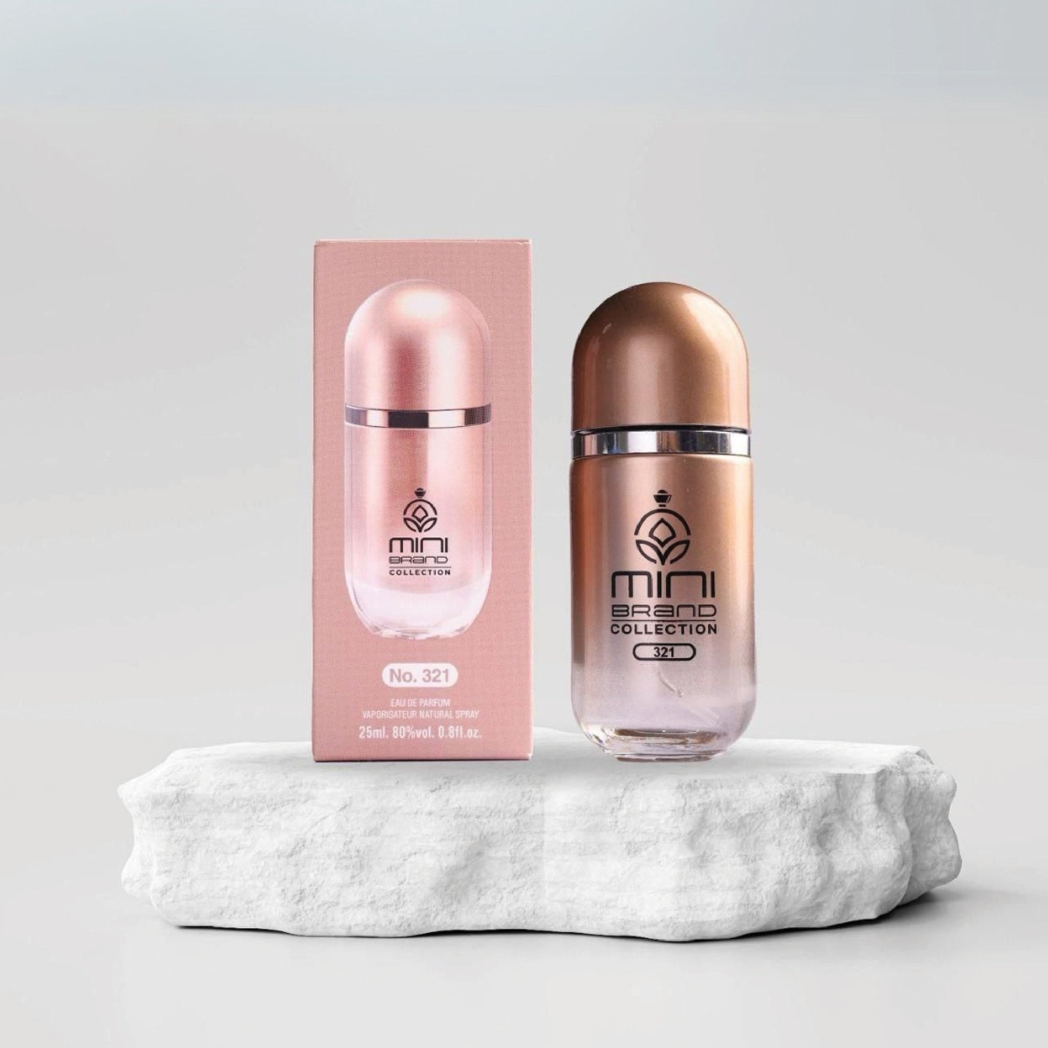Rose gold bottle and packaging with 'mini brand collection' branding on a light gray background