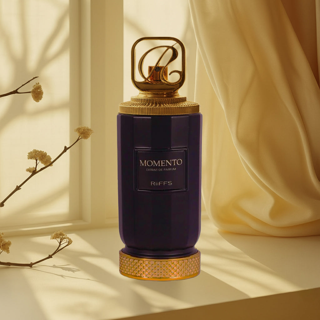Perfume bottle labeled 'MOMENTO' by Riiff's on a soft beige background