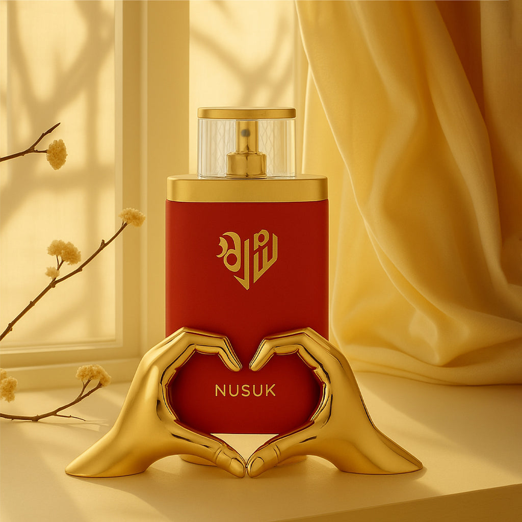 Red Nusuk perfume bottle with gold accents on a beige background
