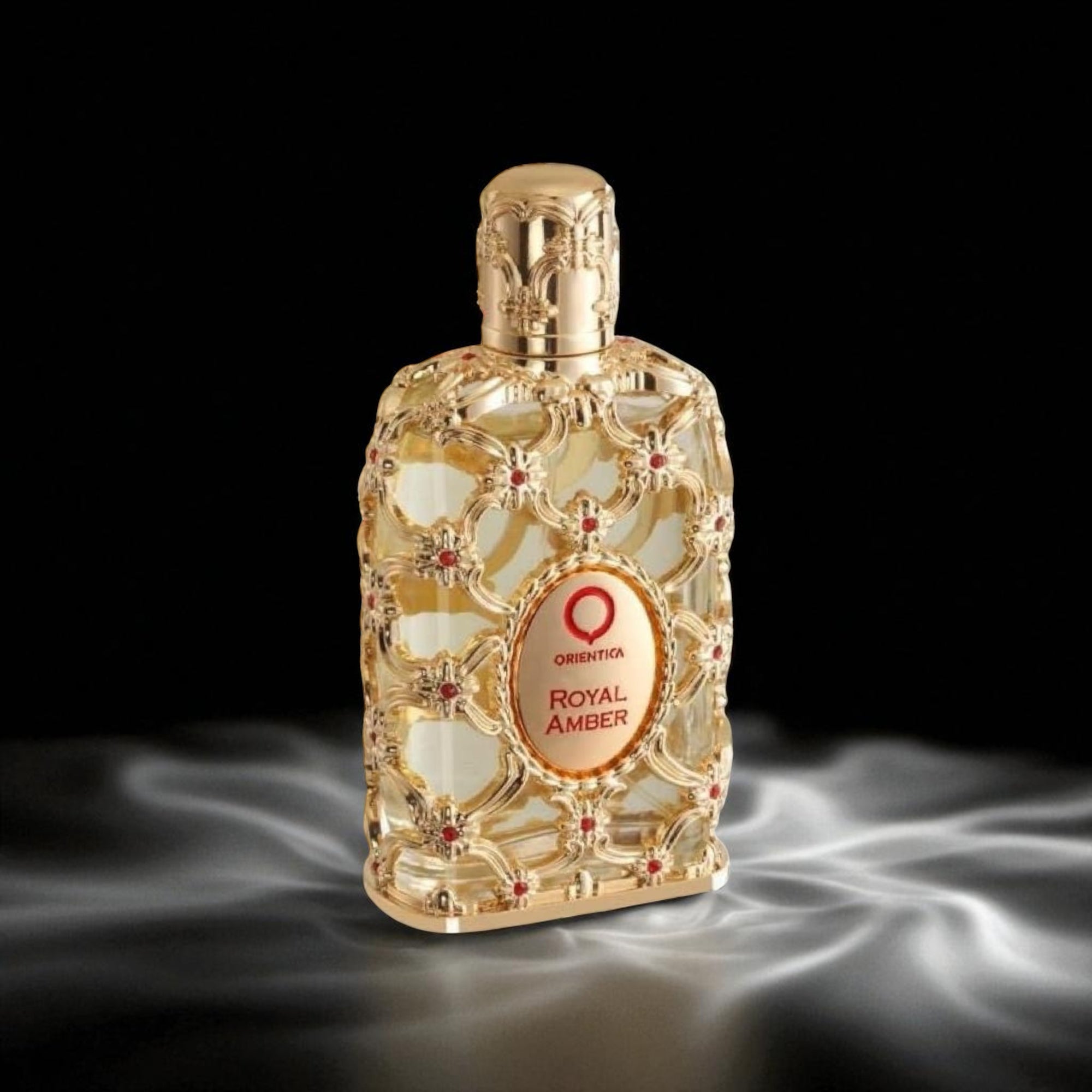 Decorative perfume bottle with 'Royal Amber' label on a dark background