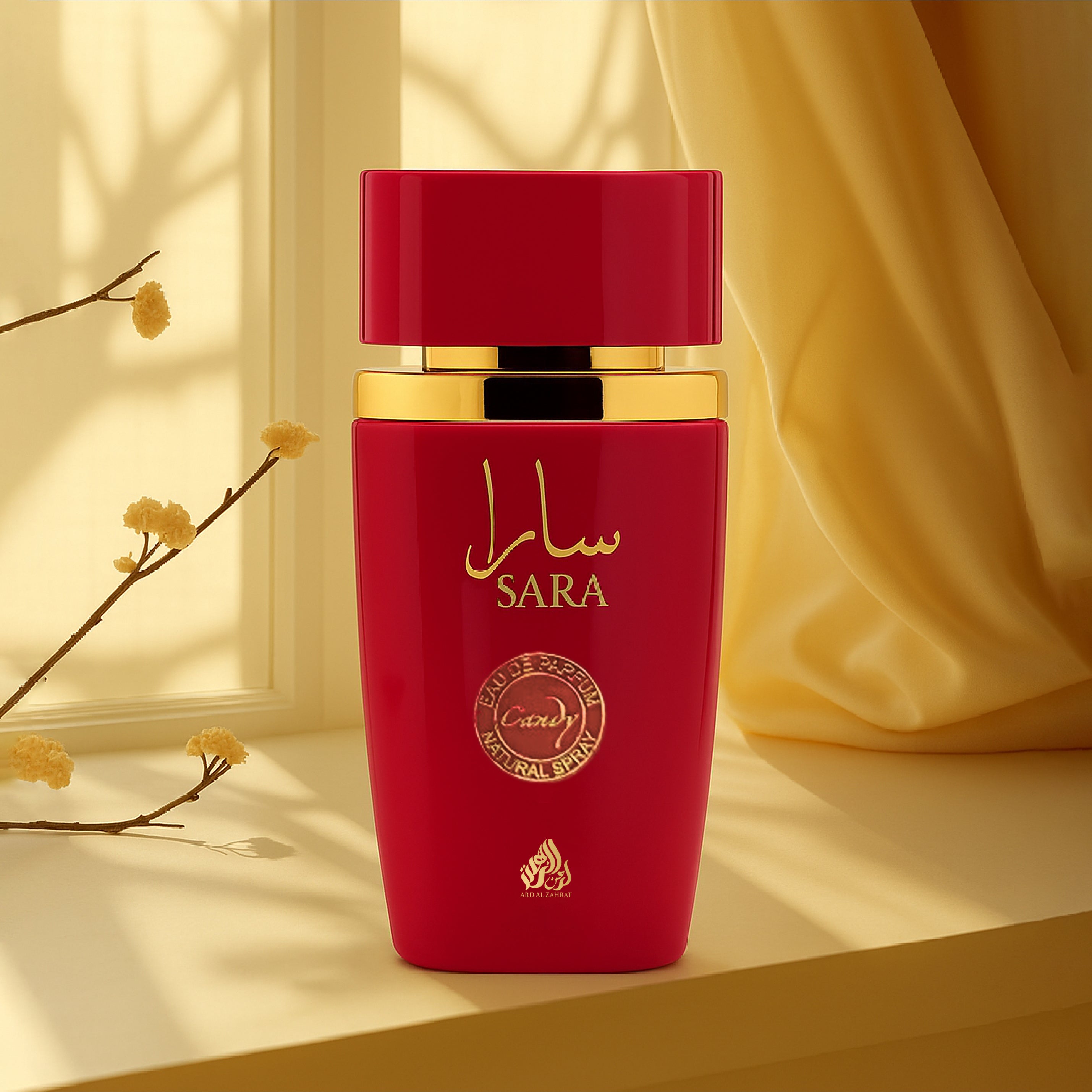 Red and gold perfume bottle with 'SARA' branding on a beige background