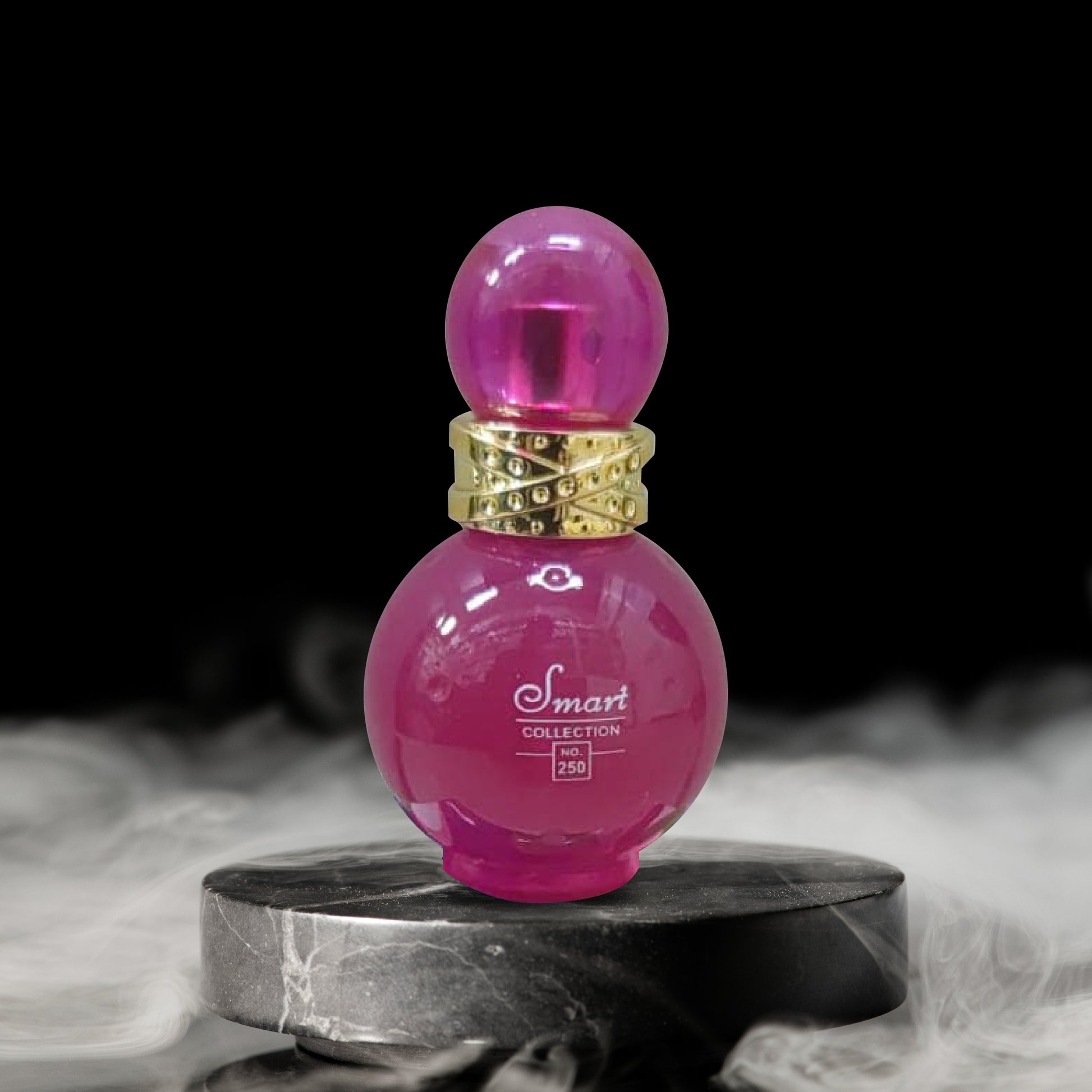 Pink perfume bottle with gold cap on a dark background