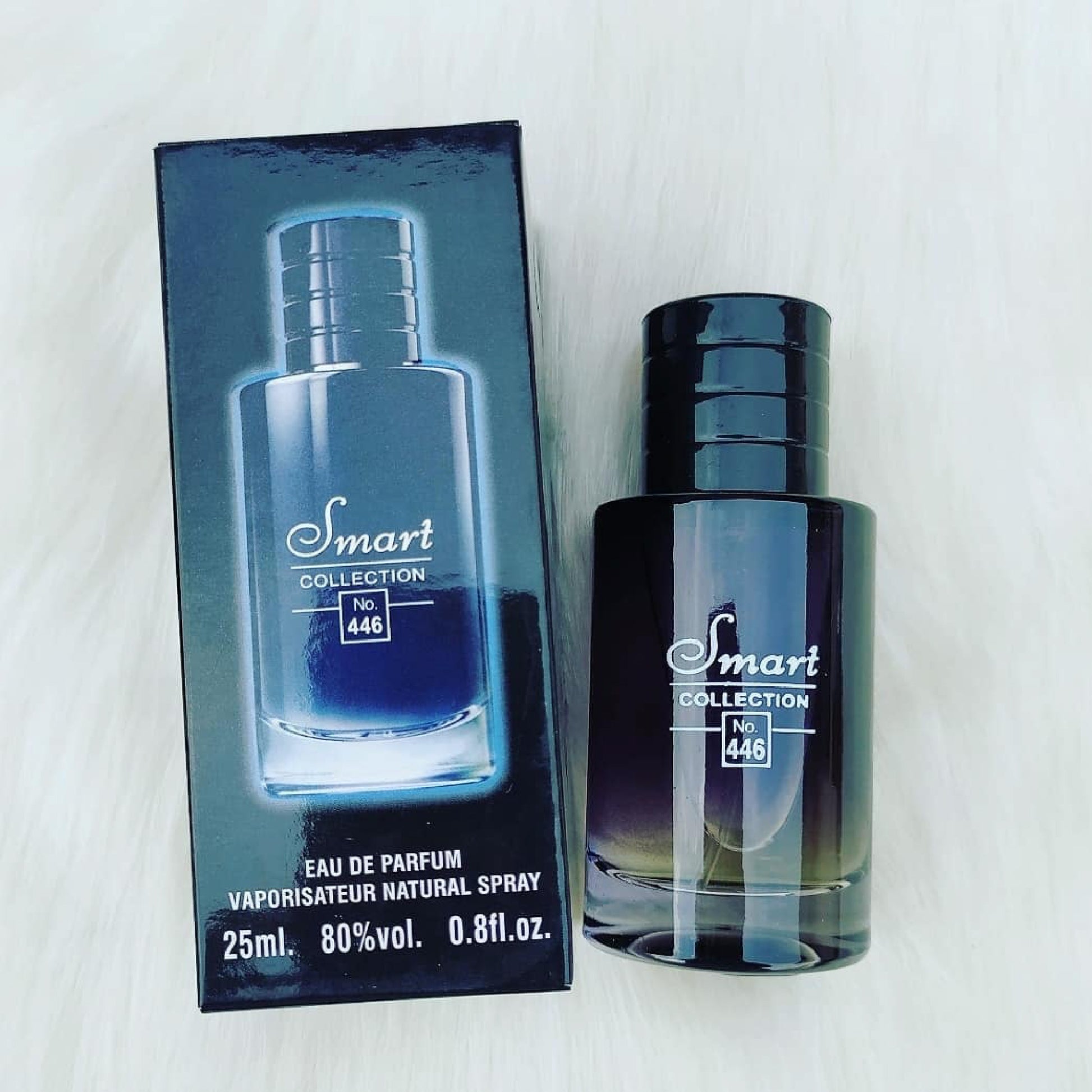 Perfume bottle and packaging with 'Smart Collection' branding on a white background