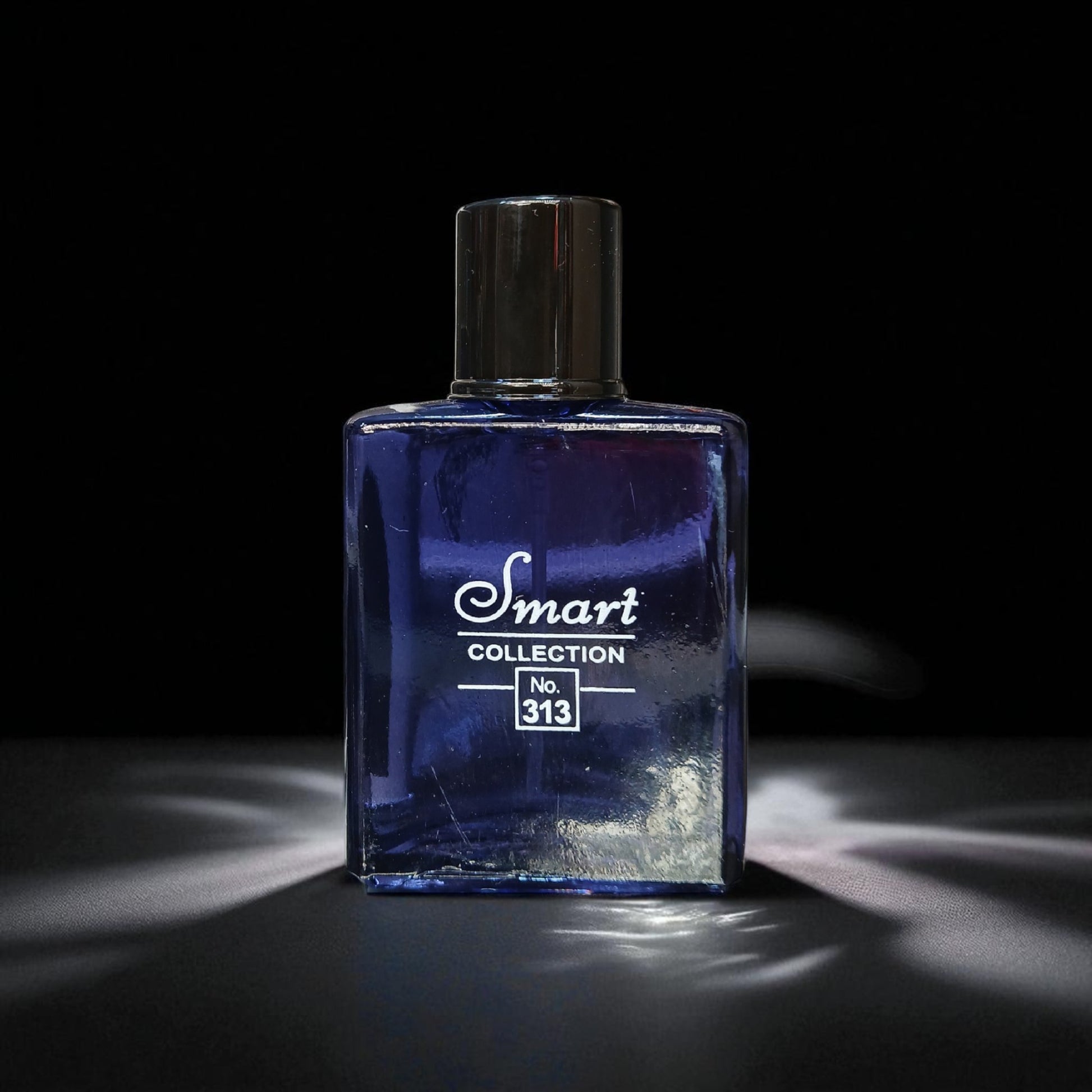 Blue perfume bottle with 'Smart Collection No. 313' label on a black background