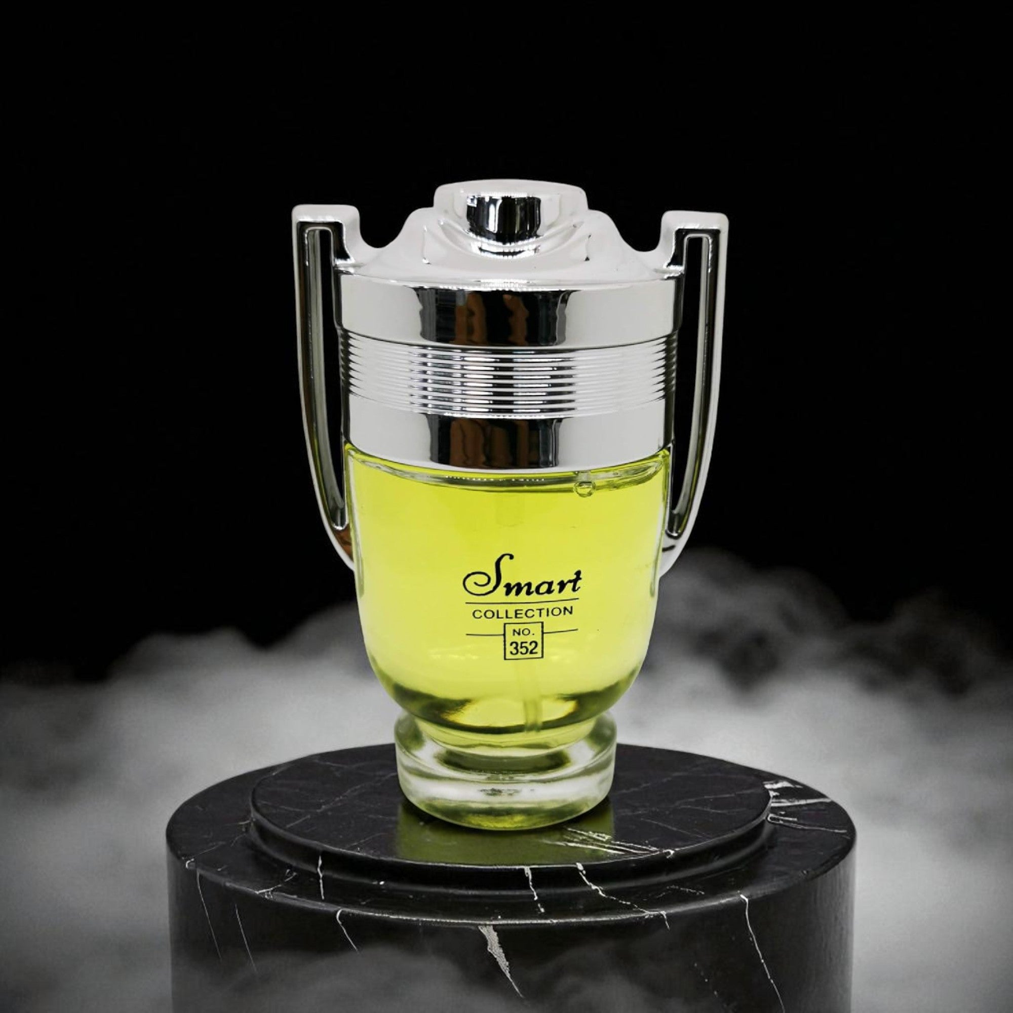 Glass container with yellow liquid on a black marble stand against a dark background