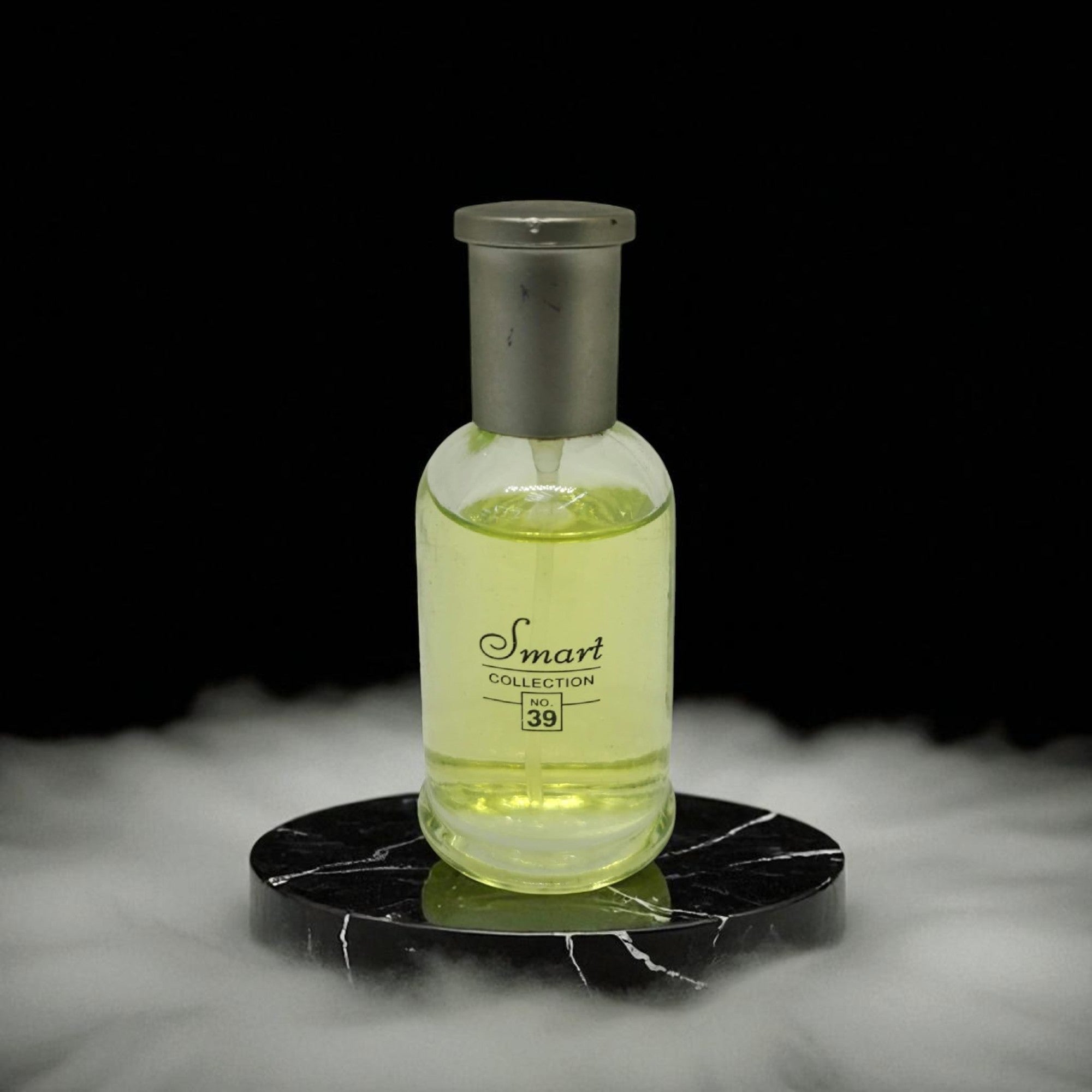 Bottle of 'Smart Collection' on a black marble surface with a dark background