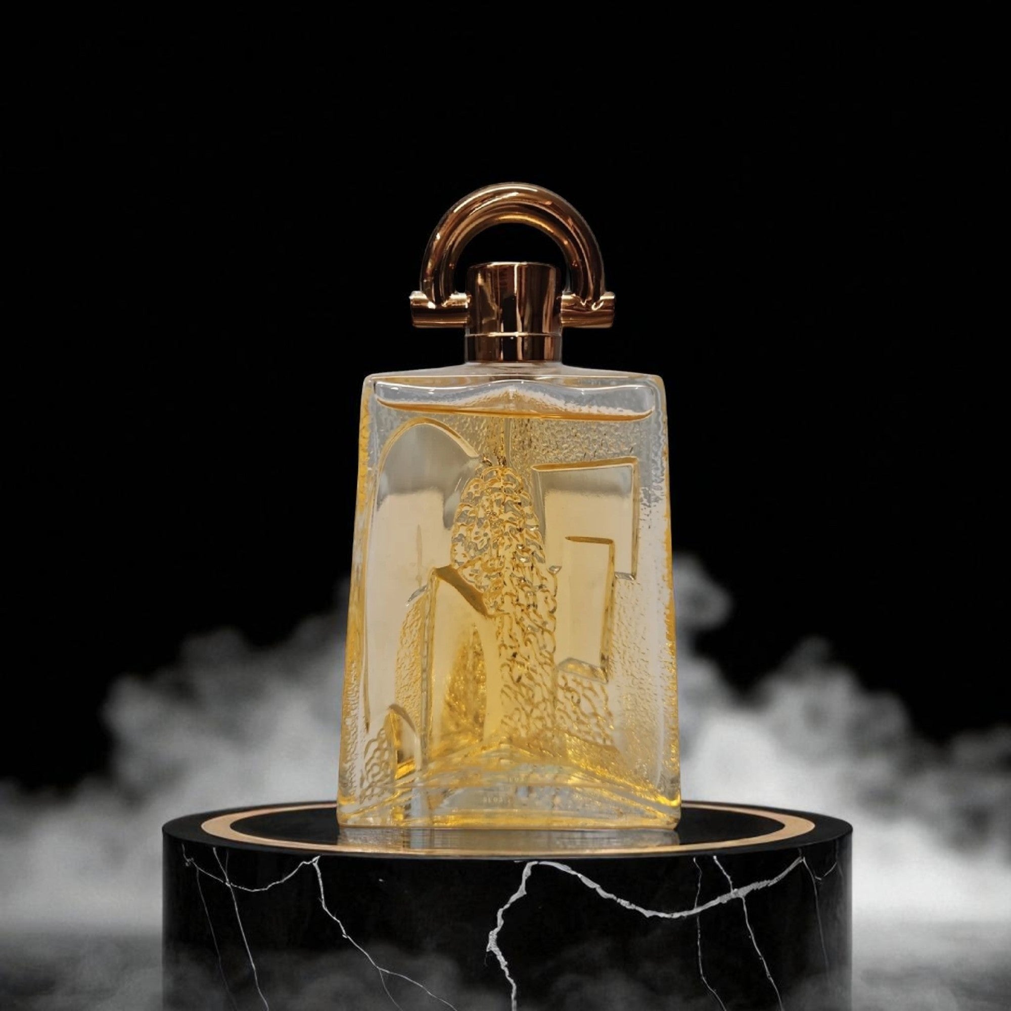 Decorative glass bottle with gold accents on a black marble base with smoke effect