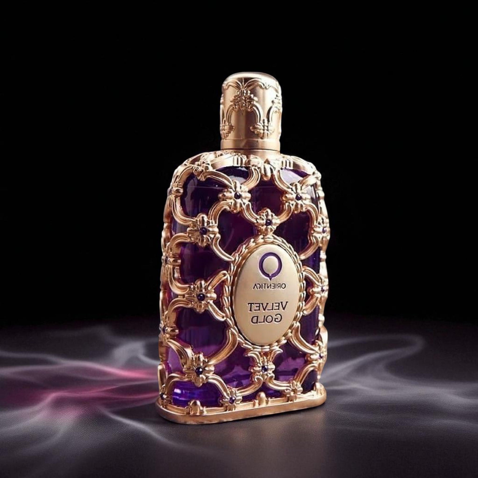 Oriflame Velvet Gold perfume bottle with intricate design on a dark background