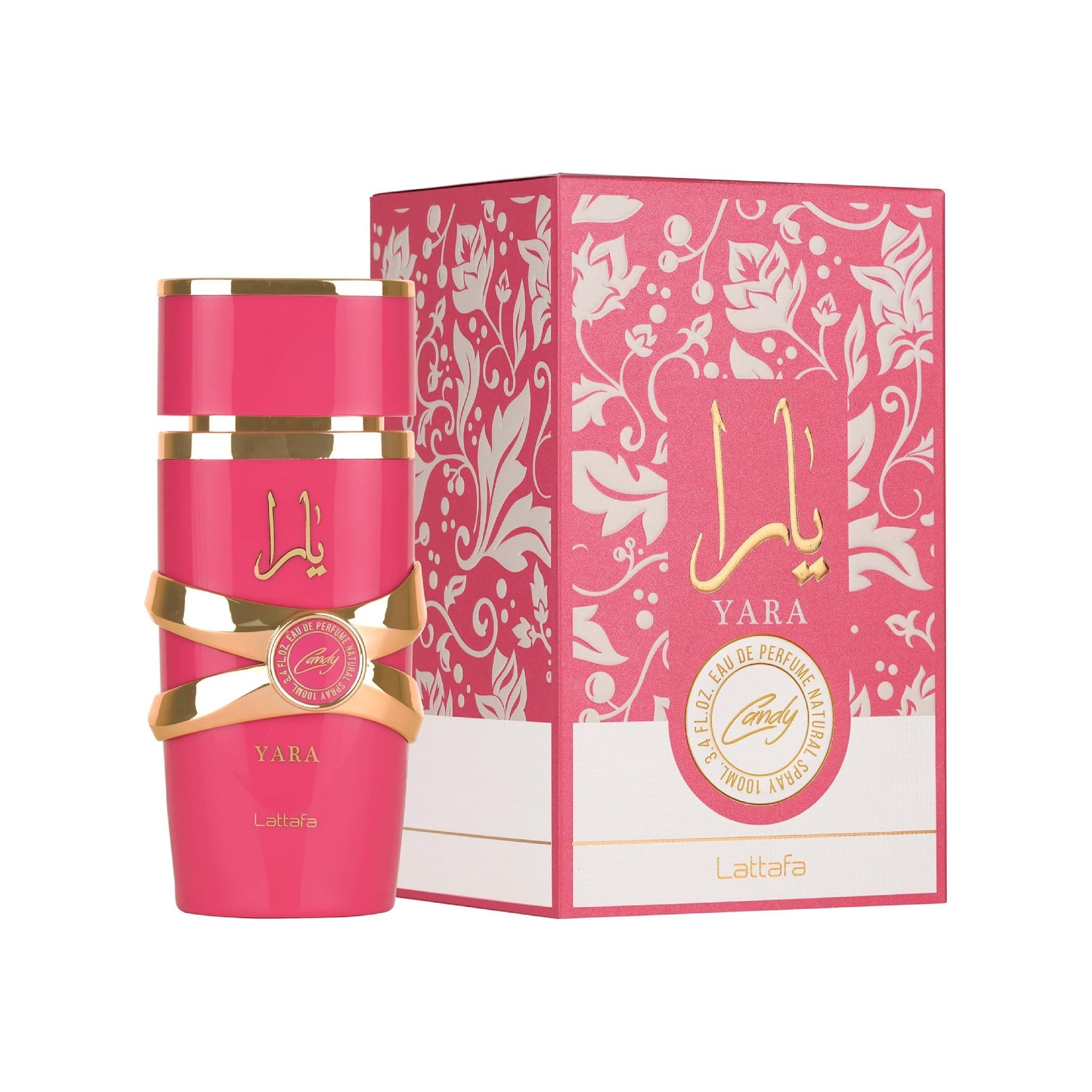 Pink perfume bottle with gold accents and matching box on a white background