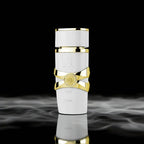 Luxury white and gold bottle on a reflective surface with dark background