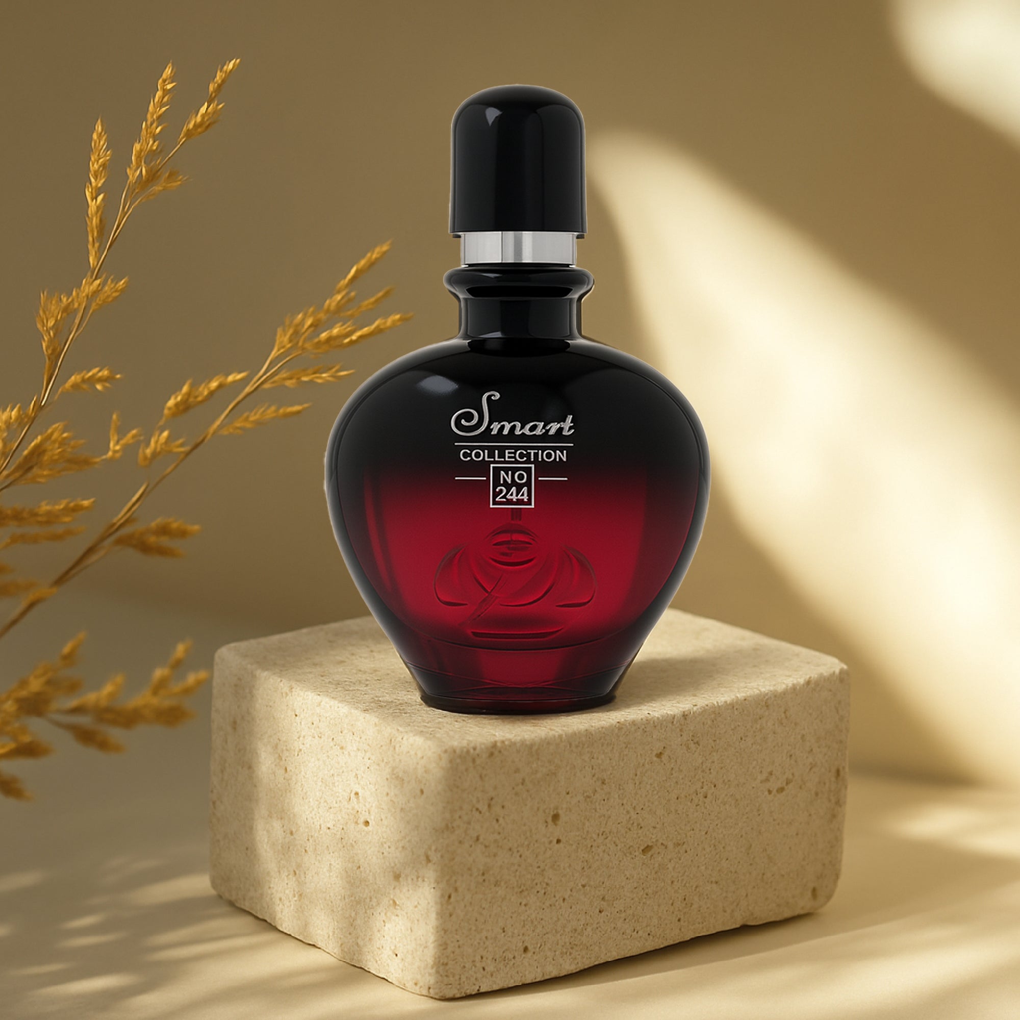 Red perfume bottle with black cap on a beige block against a beige background