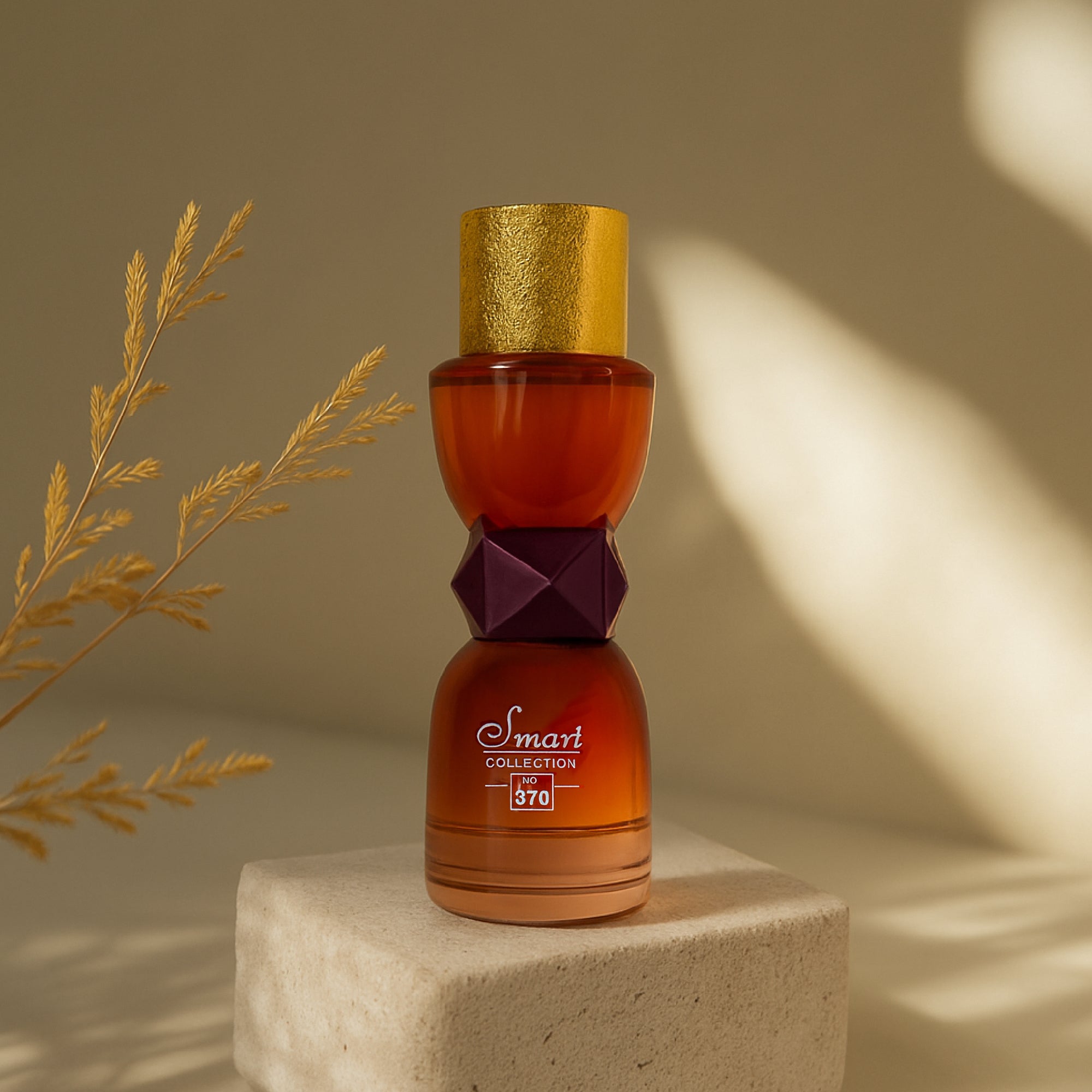 Decorative bottle with gold cap and brown body on a beige pedestal against a neutral background