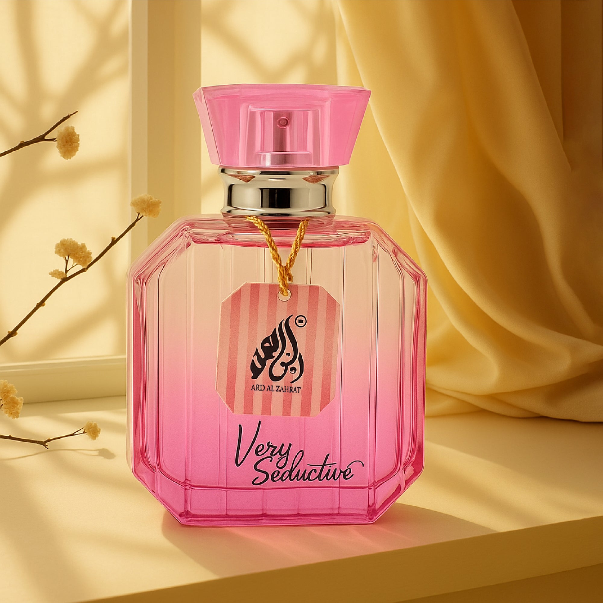 Pink perfume bottle with 'Very Seductive' text on a yellow background