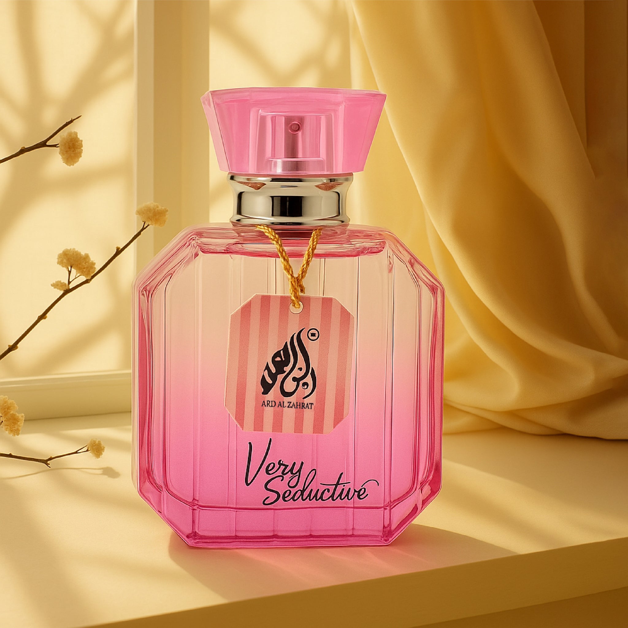 Pink perfume bottle with 'Very Seductive' text on a yellow background